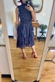 Based on other reviews, I decided to go with the XXS and it fits perfect. Material is very very stretchy. I am truly short so I decided to tuck in some material inside waist belt and I think I can get away with it lol. It's really pretty. Definitely wedding guest type of dress. Can't wait to wear it! - Silvia S.