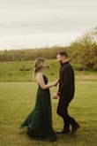 I wanted something dark and dreamy for my engagement photo shoot and this dress was truly perfect. The slit was a little high for me so I threw a few stitches into it and it was perfect. - Riannon S.