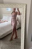 The material is thick enough to flatter and covers enough to be comfortable no matter how you move. The top is a little big on me, as to be expected, but that's fine. I tuck the top into my bra for more separation between the top and the skirt. - Jordan B.