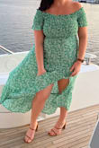 Wore this to a baby shower and got lots of compliments! There is stretch in both the arms and chest, so you could probably size down if you're typically between sizes. 

The leg slit also comes up slightly higher than I expected, but it wasn't scandalously high. - Kara G.