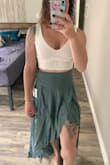 Thick material to where I don't need a bra which is awesome. Sturdy material but still very comfortable. Hugs the curves and flatters perfectly. - Sarah G.