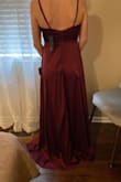 I ordered this as a bridesmaids dress for my brother's wedding. The color and material of the dress were beautiful. When I tried it on, it was super long. It is also a very low cut in the front. Even my strapless bra showed. You would have to wear stick-ons or get it altered to fit better. This dress would be great for someone who is 6" taller than me. Overall I would say that this is not the dress for me. The cost to alter the dress wouldn't even be worth it! - Lindsay K.