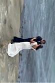 I was scared my tummy would show too much in the pictures since it's a mermaid style, but this dress was perfect, everything I expected it to be. It hugged my curves very nicely. I eloped at the beach and wore lace sandals as well, it was perfect for my dream day. - Mara T.