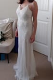 I love this dress! From the second I took my first peek through the garment bag zipper I couldn't wait to try it on. The quality of the bead work is excellent, the color is white, but not too white, and overall it feels well made. It fit well straight out of the box, and I'll just need to get it hemmed, and I'll get the straps reinforced and fit to size. It's a little bit heavy and the adjustable straps lengthened back out after a while wearing it. There aren't any cups in it, so I'll probably have something a little supportive added in as well, as I'm a  34 D and planning to dance! I can't wait for the big day! I feel great in this dress. - Er M.