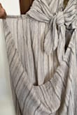 First let me say, I love this dress and couldn't wait to get it to take on a trip--tomorrow. HOWEVER, it is defective. I don't know if there's no quality control or if it's someone's broken return or what; I love Lulus & have never had a problem, ever. At first, I thought I was missing a strap or something but then I realized the back has NO ELASTIC in it. You can tell just by looking at it, don't even have to put it on to tell there's a problem; you can see in the pictures I took what it looks like. So disappointed. Can't get a dress in the next 8 hours for my trip so I definitely lost out on this one. If it wasn't defective, it would have been darling. From what I could tell, it fits perfectly. - Kodi E.