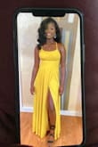 The dress was absolutely great. The straps stay in place when you adjust them, unlike any other dress...BUT THE SLIT IS VERY HIGH YOU NEED TO GET IT SEEMED. It is so high it goes up to your belly button but other than that :) - Nailah A.
