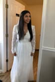 Wore this dress for my wedding! Loved the feeling of the dress was a little heavy but wore it all night! Had to get it altered on the sleeves for a tighter fit, as well as the waist and length due to my height lol but I felt beautiful in this dress would recommend sizing down! - Christina V.