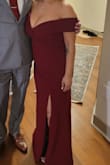 I absolutely loved this dress! The red is a nice burgundy that isn't too bright or too dark. The slit adds a nice touch and does not make the dress "too sexy" for a formal event.
Beware sizing if you have a larger chest. I am a medium in everything, but a medium would not zip up over my chest. I am a 36D-36DD. I had to order a large, which fit and had great support. Lulus has an easy return/exchange process, so I had no issue buying multiple sizes.
Photo Note: I'm only 5'1 so I got the dress hemmed to wear with ~4-inch heels. The dress was not altered in any other way. - Andrea M.