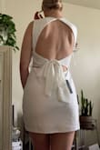 So beautiful! I sized up and got an XL instead of a L that's why I said this dress runs small is because I knew it would be too short if I didn't. This dress is so flattering and the back is breathtaking. - Emily J.