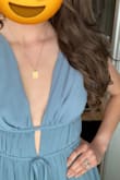 Runs a little bit big- I am usually a 4 in dresses and this XS fit me great! The chest is a little loose but clothing tape did the trick! Such a beautiful, flattering dress and comfortable too! - Christina B.