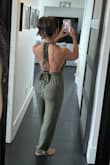 Super cute jumpsuit, except I'm short so in certain angles, it looks frumpy. Other than that, the straps feel a little long, but I guess if you're wearing it like the model, it does require the length to twist around the waist. I just wanted it to be a halter so I was struggling with it for a bit. Might decide to cut it off later.
Bum looks a little baggy too, but no fault of the outfit. I'm just short! - Desiree P.