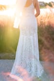 I cannot say enough about this gorgeous dress. It was everything I wanted in a dress for a small wedding. I received so many compliments on this dress and everyone was shocked when I told them it wasn't from a bridal store and how much it cost. I did need it to be hemmed as I was stepping on the bottom while wearing heels. - Katie B.