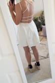 I'm usually a small for Lulus dresses but after reading reviews sized up to medium and it fits perfectly. My only complaint is that the skirt falls kind of weirdly making it stick out on the sides but I think that's because the fabric is so thick and probably needs to be steamed. - Kathryn M.