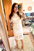 When I opened the dress it looked very small. I ordered a medium like my usual size but it did fit perfectly. It has a little stretch to it. I did think the dress was very cheaply made. They didn't trim it properly with loose thread and a thin under layer. But overall I really liked the dress. I got this for my bridal shower. I tried on 3 others from different places and this one was the winner. Even though I thought the under layer was thin it did conceal everything. Overall great dress just didn't think it was worth the price or should have been better quality for the price. - Ashley D.