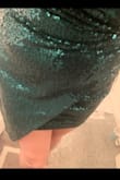 I couldn't resist ordering this dress, even though I had/have nothing to wear it to. It is so cute and so shiny! The bias cut on the front is really cool and does a lot for the personality of the dress. It does feel short for this 30-year-old at this time in my life, definitely not something I can even do a "ladylike kneel" in to bend down for any reason. But that could be my booty/body shape. An extra inch and a half in length would make a big difference. I'll wear it at some point, maybe with tights or on a night I feel like being an exhibitionist. - Kelsey M.