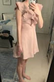 I wanted to love this dress and I do think it's super cute. It just wasn't long enough for me. The rest of the dress fit me perfectly. It is just extremely short. Even wearing flats I couldn't get away with it so forget trying to wear heels with it. Any tiny movement and I would have been flashing everyone. I would only recommend this if you're a short girl maybe 5'5 and under. Anyone taller and this will fit more like a long shirt than a dress! Really wish lulus would make more of their dresses in a tall length so us taller girls could still get a dress that fits in the body but is long enough to wear with heels. Ugh! See photos for fit on me. - Lizzy M.