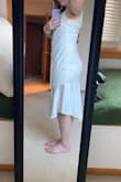 This dress looks great on some people, but I'm not one of them. It just looked like a nightgown on me with the extra fabric on my hips. The dress itself is beautiful, but it's not for my body. - Megan C.