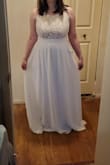 This dress was good quality, had a flattering fit, and was comfortable. It was way too long on me and felt too simple for my wedding dress. - Stacie R.