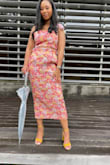 Looks even better in person. The colors and fabric are gorgeous. Received many compliments! The skirt may limit your range of motion but it's not terrible, I was still able to sit comfortably. 10/10 recommend! - Arie L.