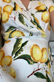 This dress is really fun and easy to dress up or down. It's a great summer style that could work with wedges or flats. It's a little loose on the bust, I plan on pinning it. It's also a little snug where you tie it at the waist. I'm keeping it because it reminds me of my honeymoon in Italy. - Sonja O.