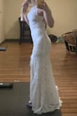 I got this dress in case I had complete wedding dress regret (I was teetering on the edge of it!) and I usually get XS in most Lulus things, but this one ran a tiny bit tight. I may have also been having some unusual weight gain at that time in which my waist was a bit bigger than usual, but whatever. Anyway, it's perfect. The length somehow works perfectly even though I'm short and the dress itself is gorgeous.
It was tight enough, however, that I probably wouldn't have been able to wear a bra or sticky boobs in it. And Spanx would be difficult too, probably - I reckon if I got bloated, you'd know immediately - Emily A.