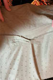 I followed the other reviews and ordered a size smaller than I normally would and it fit perfect, there was a small area on the bottom that was clinched when sewen so we adjusted the bottom I also sewed up the open area more for a more put together look and it still flowed super nicely - Ashley P.
