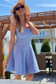 This is such a darling little dress!  The material has a feeling of very good quality.  I absolutely love the color!  The perfect little dress for a beautiful spring day!  I purchased the XXS and I am 5'0, 93 lbs. - Sherriel M.