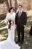 The dress fit amazing right off the hanger and with a few alterations to the design it was perfect! I shortened the bell sleeves to about half the length, closed the slit and added a bustle. - Crystal H.