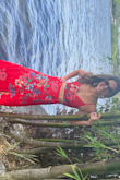 I wore this dress to a Florida wedding and got so many compliments! It is stunning! There are two layers of fabric, not much stretch but the skirt is a wrap so you can get away with making it a bit tighter/looser if you need. The top was very supportive when pulled tight. I wore silicone cups undermine. The site won't allow me to change the orientation of the photo I'm adding, it does not do this dress justice! - Rosanna M.