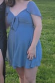 This dress was amazing. I thought the fit was great, since it has the shirred back, a hidden side zipper, elastic sleeve straps, and the front tie. I got so many compliments and felt so confident in the dress. For the bra situation, I just took some cups out of a sports bra and put them in the chest area and that worked great. I literally never leave reviews but this dress is worth it!!!
If you're concerned about modesty: this dress came just at finger tip length with my arms straight down. I definitely wore shorts underneath! It showed some cleavage on me, but nothing that some regular adjustments or fashion tape wouldn't fix if you need. Also, the cut out underneath the front tie really didn't reveal as much as I thought it would, since you can tie it in a way where the ends cover it. - Katie O.