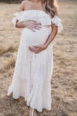 I bought this in a size small hoping it'd work as a maternity dress (pre-pregnancy size XS, 108lbs), and it worked perfectly during my maternity shoot (was 32 weeks at the time)!! Turned out beautiful, obsessed with my photos! - Michelle K.