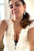 First of all, Wow. This was a 2nd choice & knew it was the "one" when I got chills. I ordered another style, first, but had to return for another size; the size needed was not in stock & didn't want to be on the wait list. So I choose this, & super happy I did! The lace is beautiful & is more white in person. All it needs is a hem, with the right undergarments. The fit is perfect for a petite build w/ an hourglass shape.
Overall, I feel so beautiful in this dress & look forward to wearing it on the BIG Day, for an intimate ceremony at a local park! I highly recommend. Thank you Lulus for providing my dream wedding dress, at a budget friendly price!
P.S. wearing 3 inch heels in the photo. - Erika G.