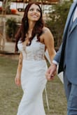 I wore this dress on my wedding day and it was so beautiful. I was on a budget and didn't want to spend a lot on a dress I was only going to wear once. I ordered this dress and another to try on. They came quickly within a matter of days and it also comes with a dress bag. They were both beautiful but this one fit like a glove. I could not be happier with it. Everyone loved it and no one could believe the money I paid for this dress. It's comfortable and true to size. It is truly so beautiful!! - Alexsandria M.