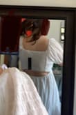 I got this dress for my graduation and found it not very flattering on my body type. The V-neck was way too low and too loose fitting to where you wanted to wear a bra but could not. I am usually a medium but I could have a size down to small, however, I am unsure if the small would have fit right. It was not for curvy bodies and resulted in me looking very wide. Not my favorite - Sydney V.