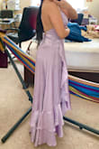 I would recommend this dress if you want something simple but an elevated look w/ a pop of color.
Shape/Fit: I'm 5'4 w/ somewhat of an hourglass body type. The dress hugs my waist but still gives me a lot of breathing room. In the photo I'm in 3.5 in heels, 4.5inch heels was the perfect length for me where the dress was barely touching the floor. The bust does hang open a little bit when I bend down but that is an easy fix with some fashion tape and pin.
Quality: I was skeptical because reviews said that the strings wouldn't last or broke. But when I received it, everything was in really good shape. The dress has a nice weight to it but isn't too light or heavy. The material is pretty cooling and great for spring/summer weather. I tested the strings to see if they would rip or tear and they didn't. Since the fabric is more satin like, the bottom of the dress did start sticking a bit to my legs but that's an easy fix by putting on some extra lotion. There weren't any loose strings or stitching. - Kat H.