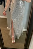 This dress is so freaking beautiful. I bought it for $53 including my student discount and I cannot tell you how amazed everyone (myself included) was. The zipper was a bit challenging to get up once in reached a certain point, and I was prepared to have the zipper altered, but all is well and I literally wiggled my way through the problem. It was not the easiest thing to put on. If you are planning on dancing, just beware you could slide out the top. I almost flashed my dance partner, haha-no, literally. - Jerica D.