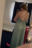 Ordered this for a wedding I am in that required a similar shade of green for my dress. I loved this dress, as it fit well and was flattering on me, even with my small chest. Absolutely love the material and also love the buttons on the side. Returned to go with a dress that was closer to what I needed for the event; would certainly consider purchasing in another color though! - Madison N.