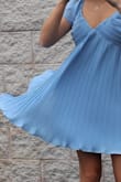 Absolutely beautiful dress! The material of the dress is so pretty and makes it look fancier in person. I am usually between a small and a medium and a small fit perfectly! I have a larger bust for my body size and it worked great to wear without a bra. Perfect for graduation or even as a wedding guest! - Grace S.