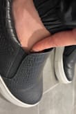 When the shoes first came they were tight, but the more I wore them the more they gave. Now they are pretty loose, and if I had known they were going to loosen up, I maybe would have gotten like half a size or a full size smaller. - Morgan O.