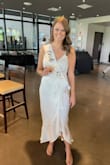 I wore this to my bridal shower and got so many compliments on this dress! I ordered this in my typical size, a Medium, and ended up sizing down to a Small. Super comfortable and flattering. - Amanda M.