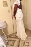The dress is perfect, fits beautifully and the material is stretchy so you can move in it. I return it because I have back rolls so it's not very flattering. - MICHERLANDE B.