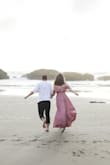 I wore this for our engagement photos on the beach. This dress had amazing flow and the *swoosh* factor was unreal. I was surprised at how long it was- I am about 5'11 and wore inch heels and still had to hold up the hem to keep from stepping on it. 
I think I could have worn a small as far as height was concerned, but the upper half of the dress fit well- with the exception of the little metal snap that's supposed to keep you from flashing anyone. It was way too high and it came open any time I moved my arms or moved at all. I ended up taking it off with a seam ripper and using a safety pin because I ran out of time to sew it on lower. I had to be careful I wouldn't flash anyone my bra line (I wore a sticky bra- would probably get just stickers next time). 
That being said, it looked amazing and had a very magical feel to it- I'd have to hem it and re-sew the snaps to make it feel truly comfortable to wear. - Monica L.