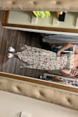 I absolutely love the dress but it seems really small in the top/rib cage/love handle area - for me at least. I ordered a small which is what I normally wear at Lulus but it was so tight it squeezed my skin out the side cutouts (see pic) so I ordered a medium and love it. I see a lot of people wearing as maternity dress which you could totally do with the belly space it gives you. - Samantha B.