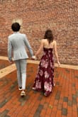 I wore this dress for prom&it is such a beautiful dress! I wore an XS and it fit so nicely:)

Pros: 
-wrap dress so it's adjustable to you and I love that
-the style is flattering on everyone
-it's nice and long! I'm fairly tall and it def hit the floor and I could wear heels with it

Cons:
-we had to sew some snaps by the chest area, there's already a snap there but it's a little low and loose so we added another for extra security
-added another snap at the slit opening didn't want to flash the world haha

I loved this dress so much. And I'm pretty sure I'll be able to wear it again to weddings or something else bc it's super versatile! - Erin M.