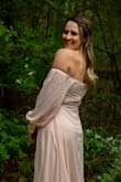 I saw this dress and was like ok it will be a stretch if I can pull it off and it looks good, but I sent it and bought it and I am so over the moon grateful. The color is even better in person in my opinion (it's like a baby pink) and it held my boobs perfectly (I was wearing a strapless bra). I felt literally like a fairy princess. I felt so confident and the buttons on the sleeves are gorgeous. The slit was not too high and it was the perfect length for me (and that is saying something because I am tall!!!). I would not pass up on this dress at all. I am so happy I went for it. - Bryn P.