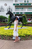 I absolutely loved this dress for the Kentucky Derby! I ordered true to size, mainly to make sure my hips would fit and they did, but the bust/neckline/shoulders were a little loose. However, it was barely noticeable and I wouldn't have ordered a different size. The fabric does not stretch so take that into account. I received so many compliments on this dress! This was my first purchase from Lulus & I will definitely order again! - Jennifer W.