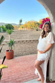 I wore this for my baby shower and it was absolutely perfect! I am usually around 130 lbs and would have ordered a small but am at 34 weeks and the medium fit great to accommodate the bump. I tried a lot of dresses and this was made me feel so beautiful right away! I'm excited to also wear it after being pregnant as well, totally recommend it! - Victoria V.