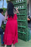The dress runs small. I am normally a L, but had to get an XL. I actually bought this dress in multiple sizes to make sure I got the right fit. I wore this dress to a Mexico beach wedding with red lipstick. In the right size, this dress is flattering for those who do not want a form-fitting dress. - Charlene T.