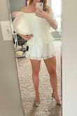 I bought this in white and pink as a rehearsal dinner/party outfit and I could not love it more. I ended up going with the white but both colors are beautiful. As a tall person with a ridiculously long torso, I struggle to find rompers that are long enough and with this being off-the-shoulder it works perfectly. The white isn't see-through at all and the shorts have enough room in them so they're not tight around your hips/bum. - Kristin H.