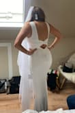 Although I didn't ultimately end up choosing it, this dress was a top contender in my wedding dress search (I would say it actualyl beat out my top picks at BHLDN!!). The material is thick and supportive. The back hits at a perfect spot if you're worried about back folds/rolls. In my opinion, this is one of Lulus best bridal items and looks like it costs more than it does. - Sydney A.
